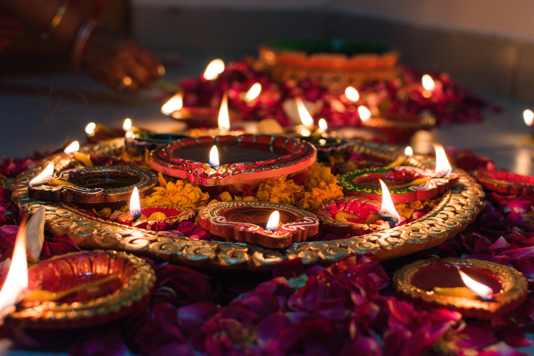 a collection of diya (oil lamps) lit for Diwali, a Hindu celebration 
